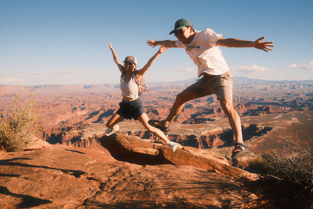 Jumping on a ledge above Canyonlands